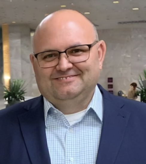 Professional headshot of Daniel Crow.