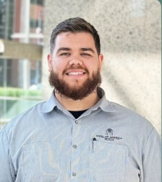 Professional headshot of Caleb Bland.